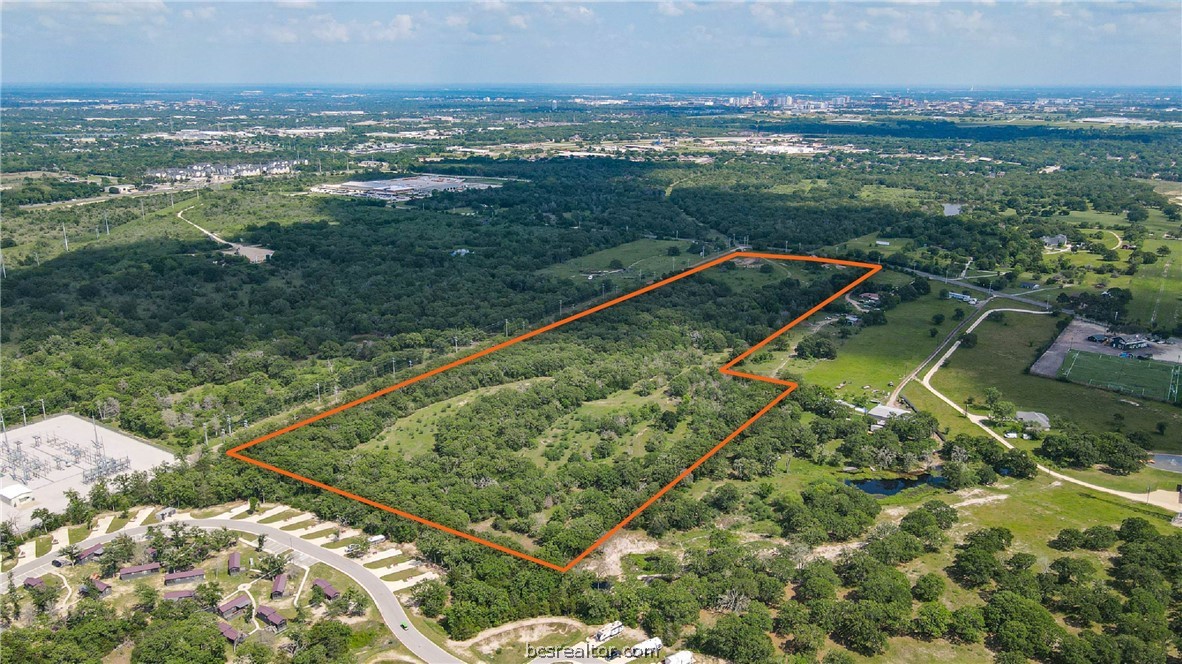4296 Leonard Road Bryan, TX 77807 - Photo 2 of 9 a view of a lake with a city