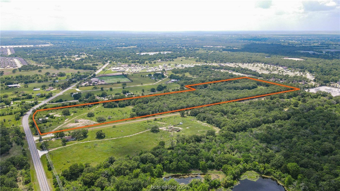 4296 Leonard Road Bryan, TX 77807 - Photo 4 of 9 an aerial view of residential houses with outdoor space and trees
