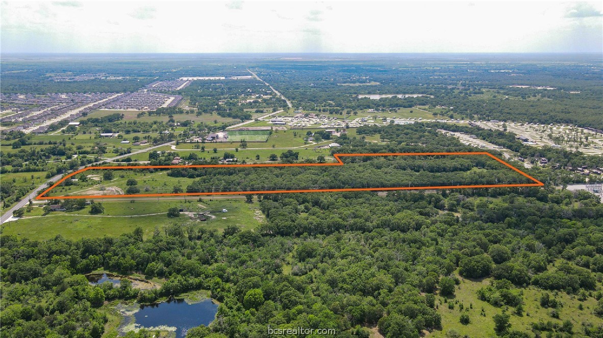 4296 Leonard Road Bryan, TX 77807 - Photo 5 of 9 an aerial view of residential houses with outdoor space and trees