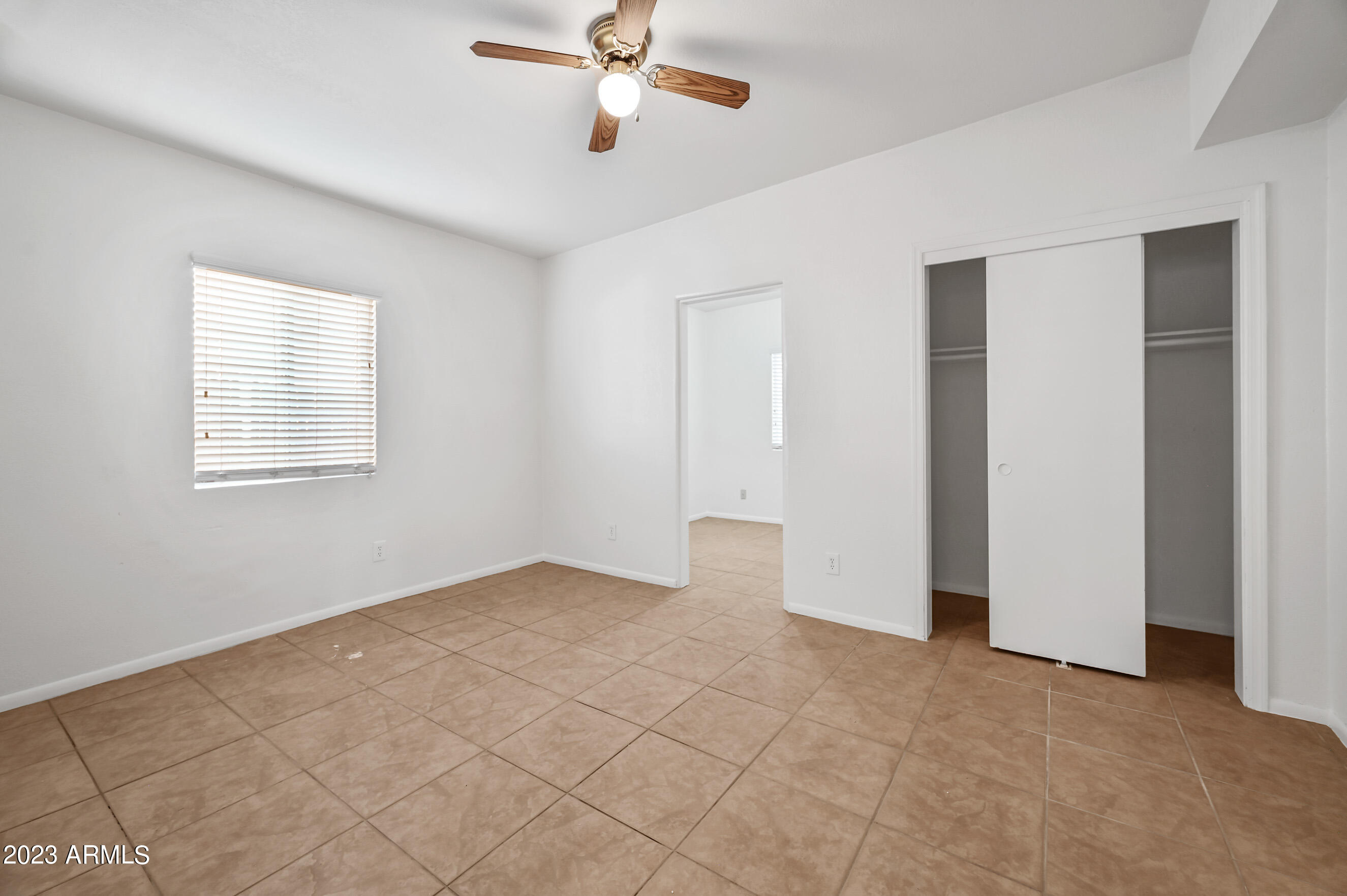 5327 East Taylor Street, Unit A Phoenix, AZ 85008 - Photo 9 of 11 a view of an empty room with a window