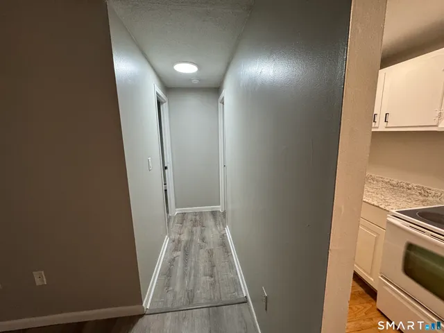 a view of a kitchen from the hallway