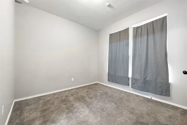 an empty room with closet area