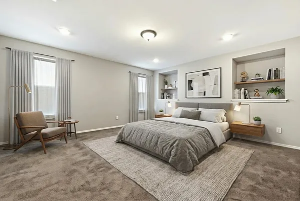 a spacious bedroom with a bed and glass windows