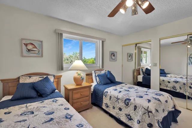 a bathroom with a sink mirror and a shower