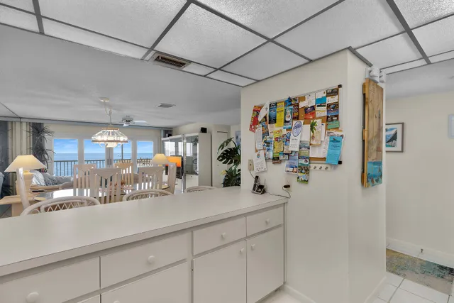 a kitchen with a table and chairs in it