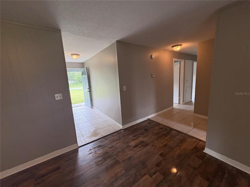 1236 Northeast 22nd Street Ocala, FL 34470 - Photo 17 of 42 a view of hallway with wooden floor