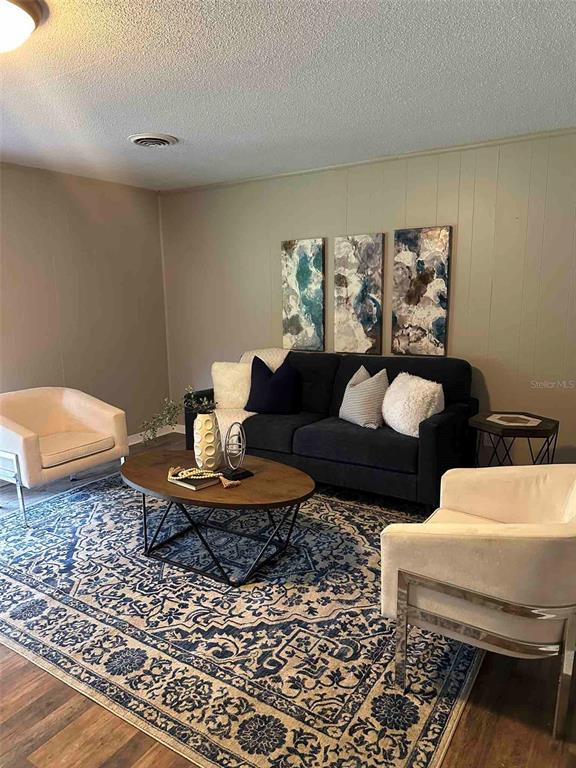 1236 Northeast 22nd Street Ocala, FL 34470 - Photo 18 of 42 a living room with furniture and a rug