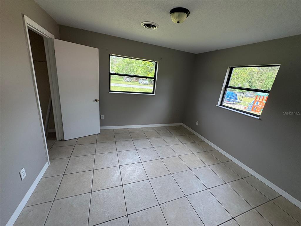 1236 Northeast 22nd Street Ocala, FL 34470 - Photo 22 of 42 a view of an empty room with a window