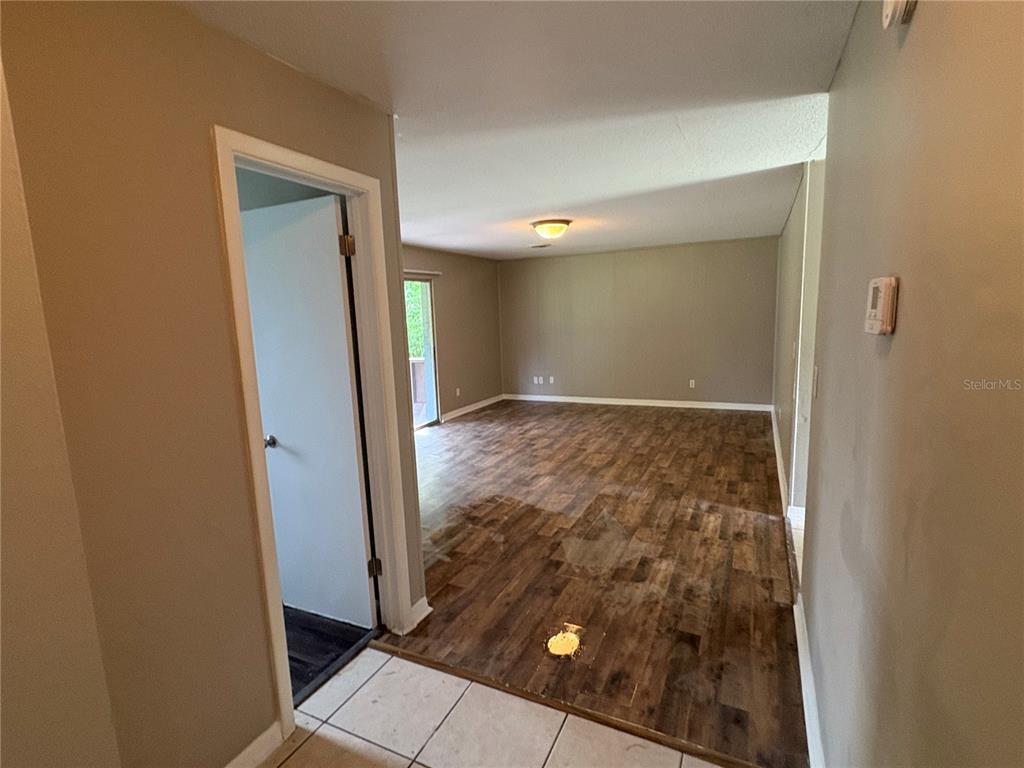 1236 Northeast 22nd Street Ocala, FL 34470 - Photo 23 of 42 an empty room with wooden floor