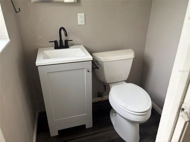 a bathroom with a sink a toilet and bathtub
