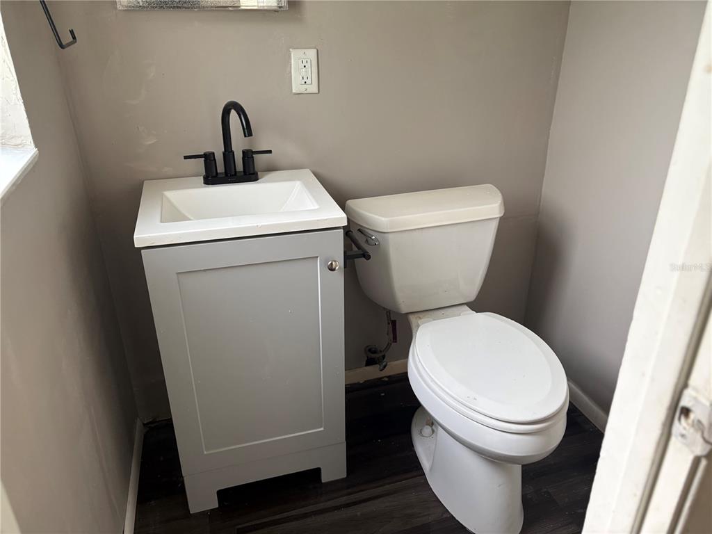 1236 Northeast 22nd Street Ocala, FL 34470 - Photo 27 of 42 a bathroom with a toilet and a sink