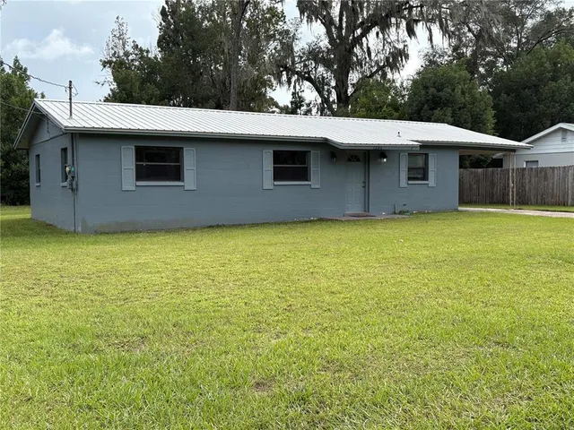 a backyard of a house with lots of green space