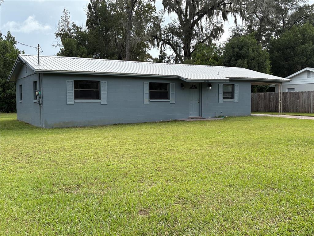 1236 Northeast 22nd Street Ocala, FL 34470 - Photo 3 of 42 a view of a house with a backyard