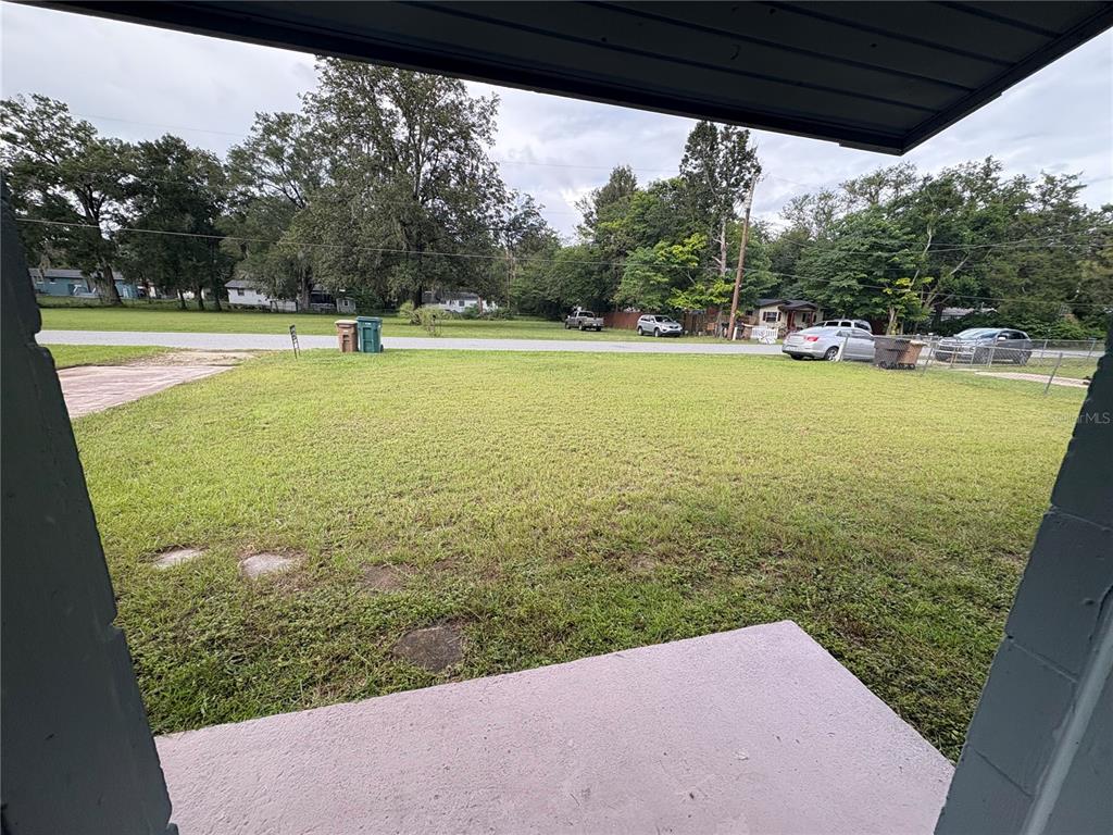 1236 Northeast 22nd Street Ocala, FL 34470 - Photo 31 of 42 a view of a swimming pool and trees in the background