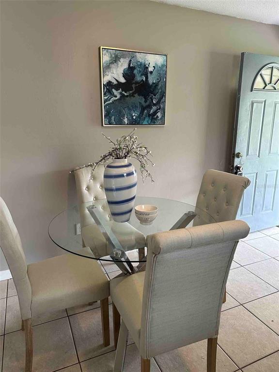 1236 Northeast 22nd Street Ocala, FL 34470 - Photo 39 of 42 a living room with furniture and a painting on the wall