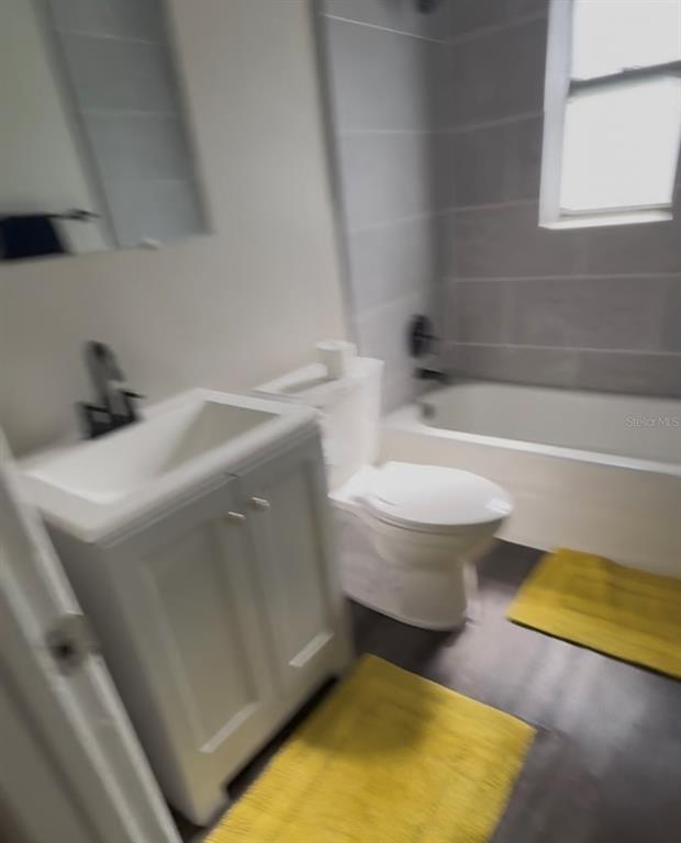 1236 Northeast 22nd Street Ocala, FL 34470 - Photo 42 of 42 a bathroom with a sink toilet and bathtub