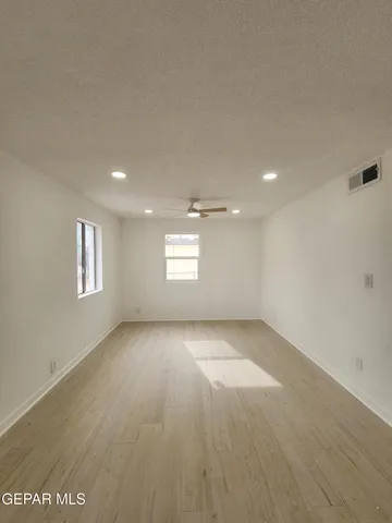 a view of a livingroom with wooden floor