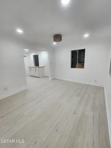 a bathroom with a granite countertop toilet and a shower
