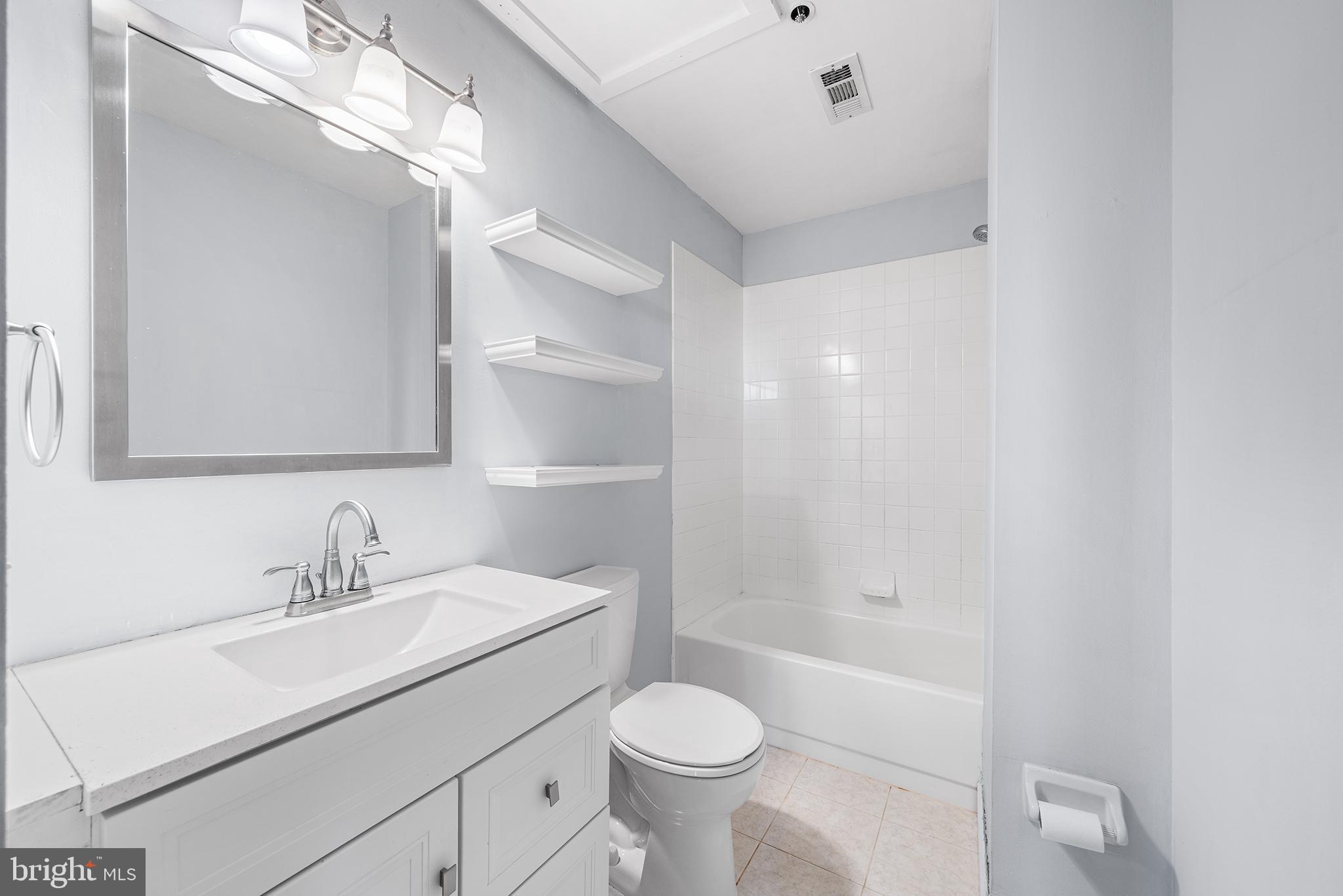 315 New Street, Unit 614 Philadelphia, PA 19106 - Photo 19 of 32 a bathroom with a sink toilet and shower