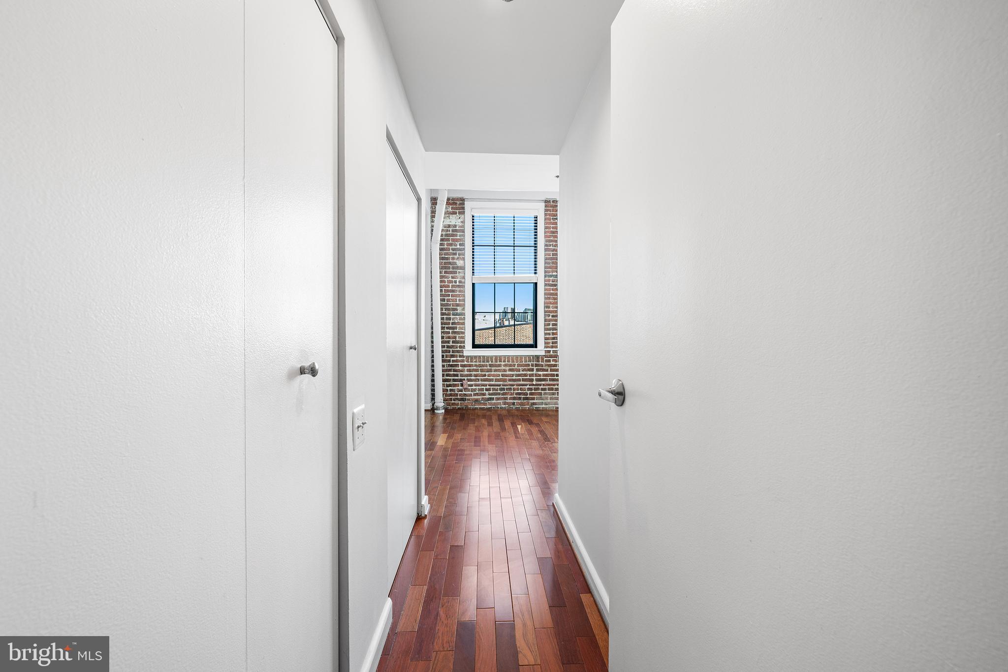 315 New Street, Unit 614 Philadelphia, PA 19106 - Photo 21 of 32 a view of a hallway with wooden floor