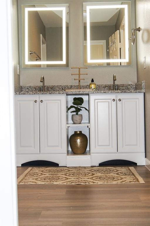 1727 Pueblo Street Dallas, TX 75212 - Photo 22 of 27 a bathroom with a granite countertop sink and a mirror