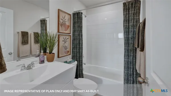 a bathroom with a bathtub and a sink
