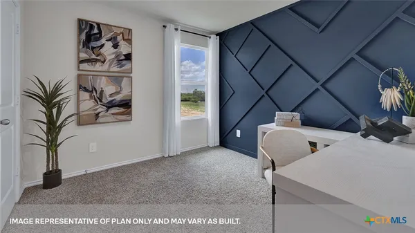 a view of a hallway with paintings on the wall