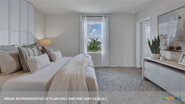 a bed room with a bed and a large mirror