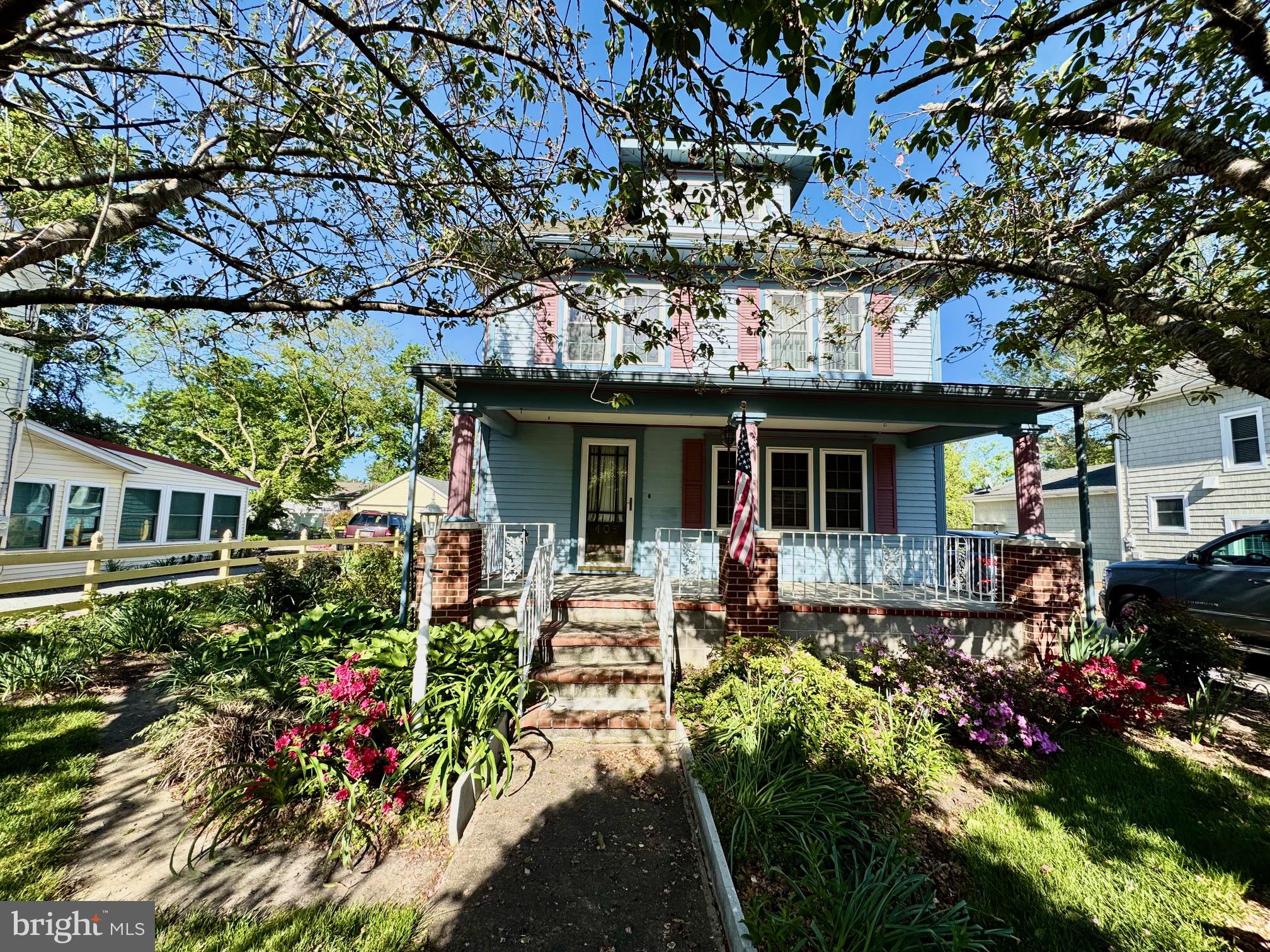 Charming home with vibrant gardens.