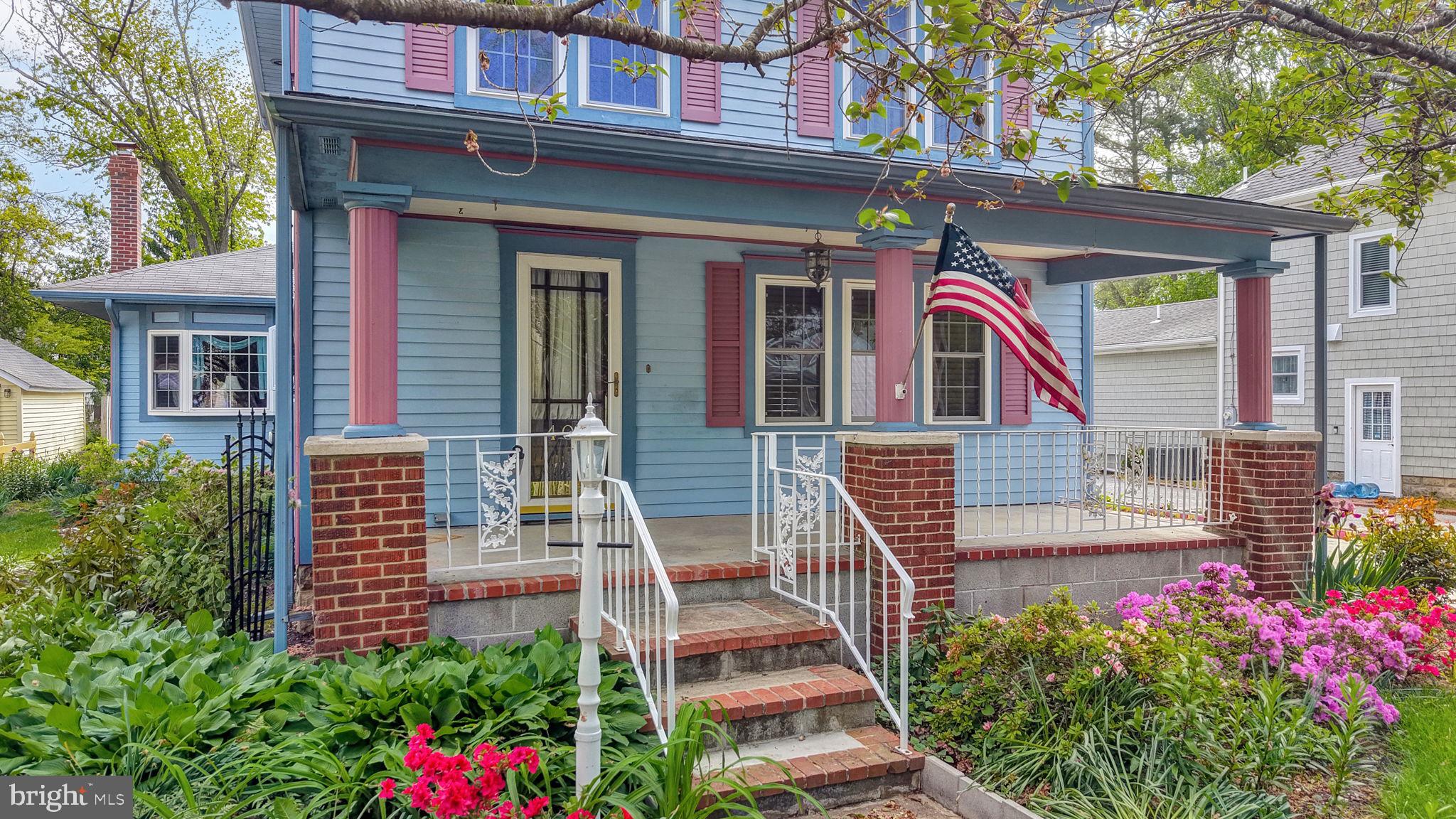 405 Union Street Milton, DE 19968 - Photo 2 of 83 Charming blue home with vibrant blooms.