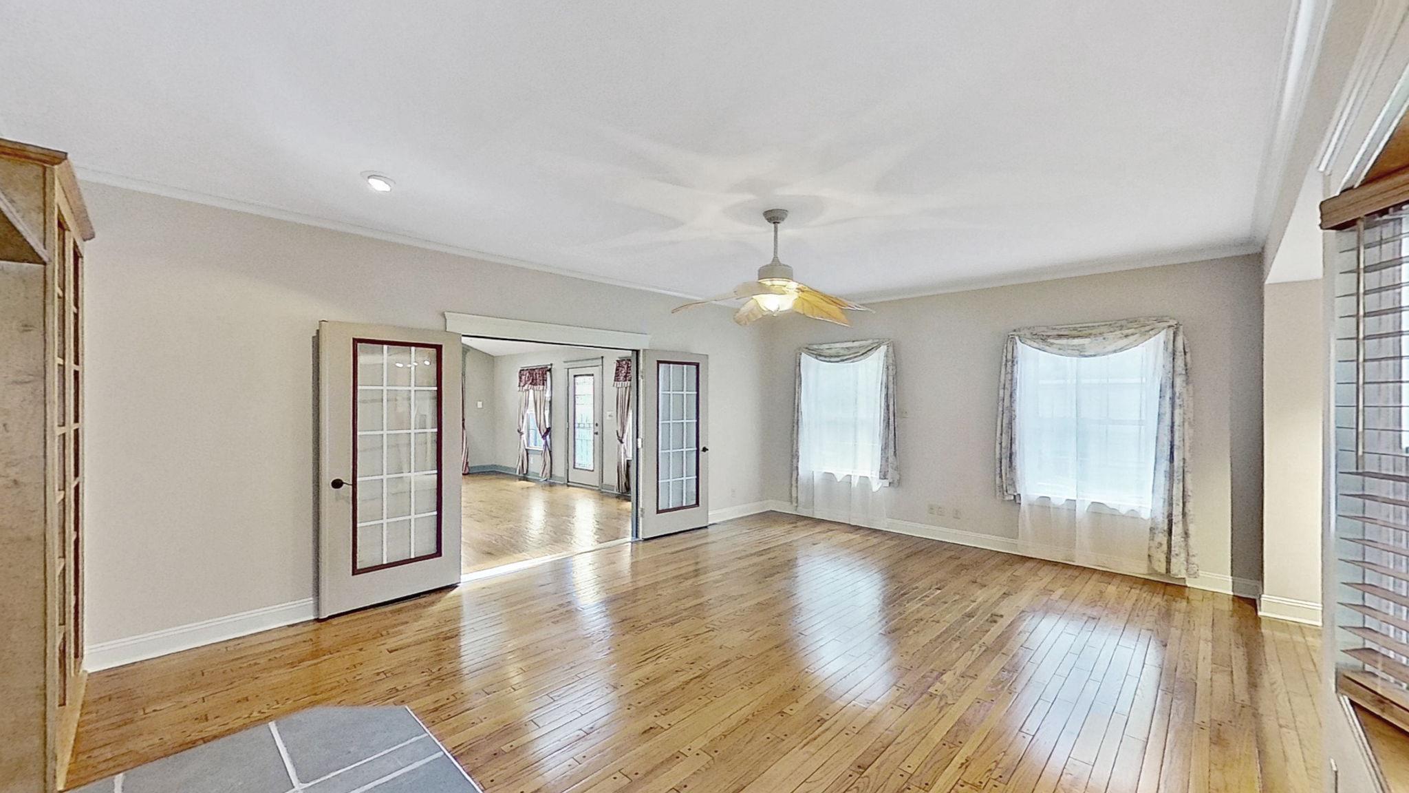 405 Union Street Milton, DE 19968 - Photo 29 of 83 a view of an empty room with window and wooden floor