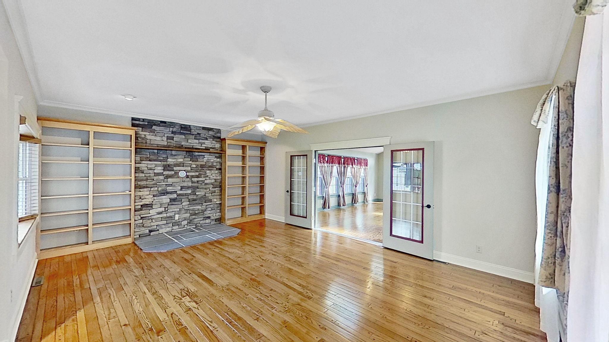 405 Union Street Milton, DE 19968 - Photo 30 of 83 Family room with custom stone wall and builtins.