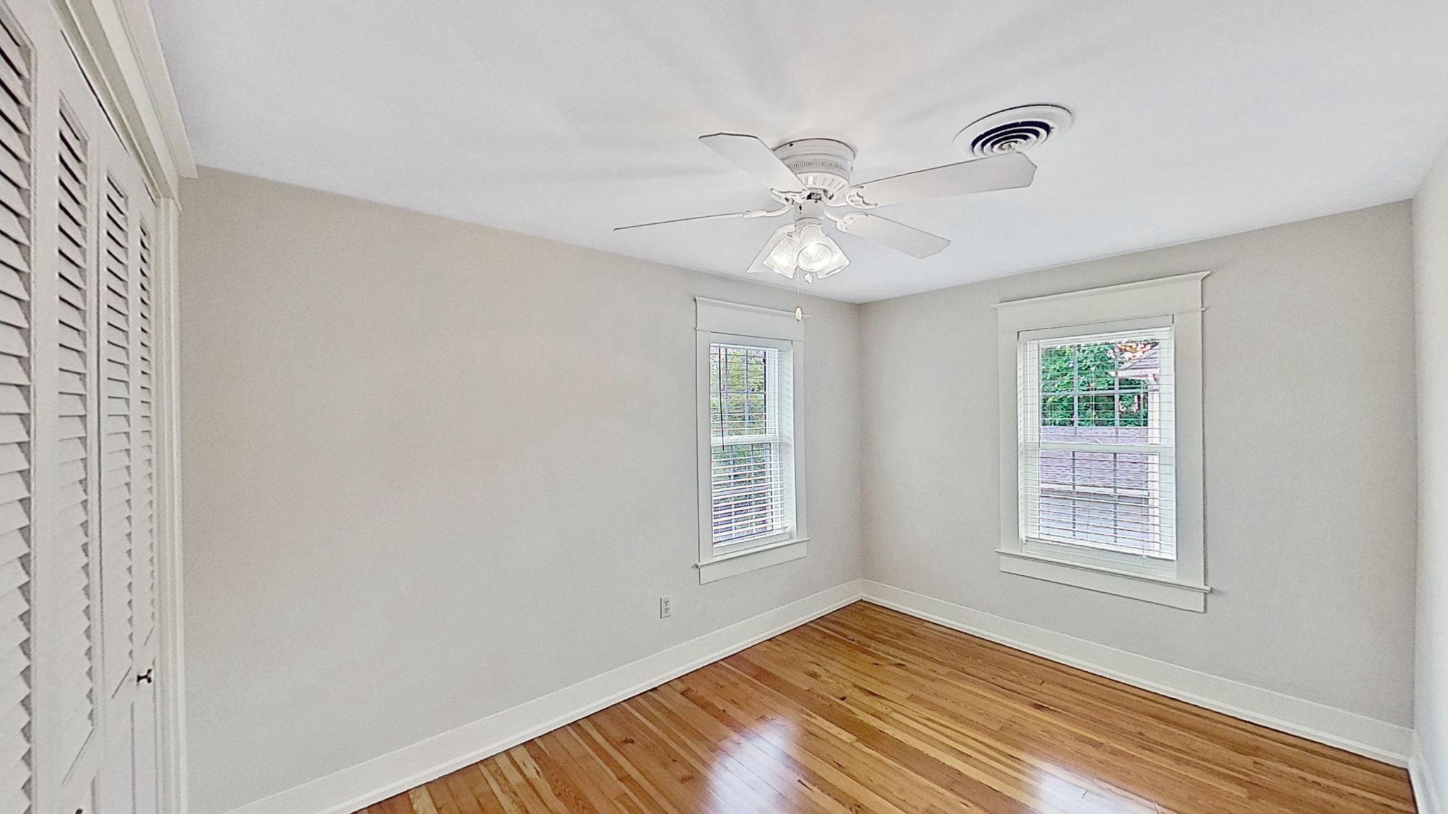 405 Union Street Milton, DE 19968 - Photo 43 of 83 a view of empty room with wooden floor and fan