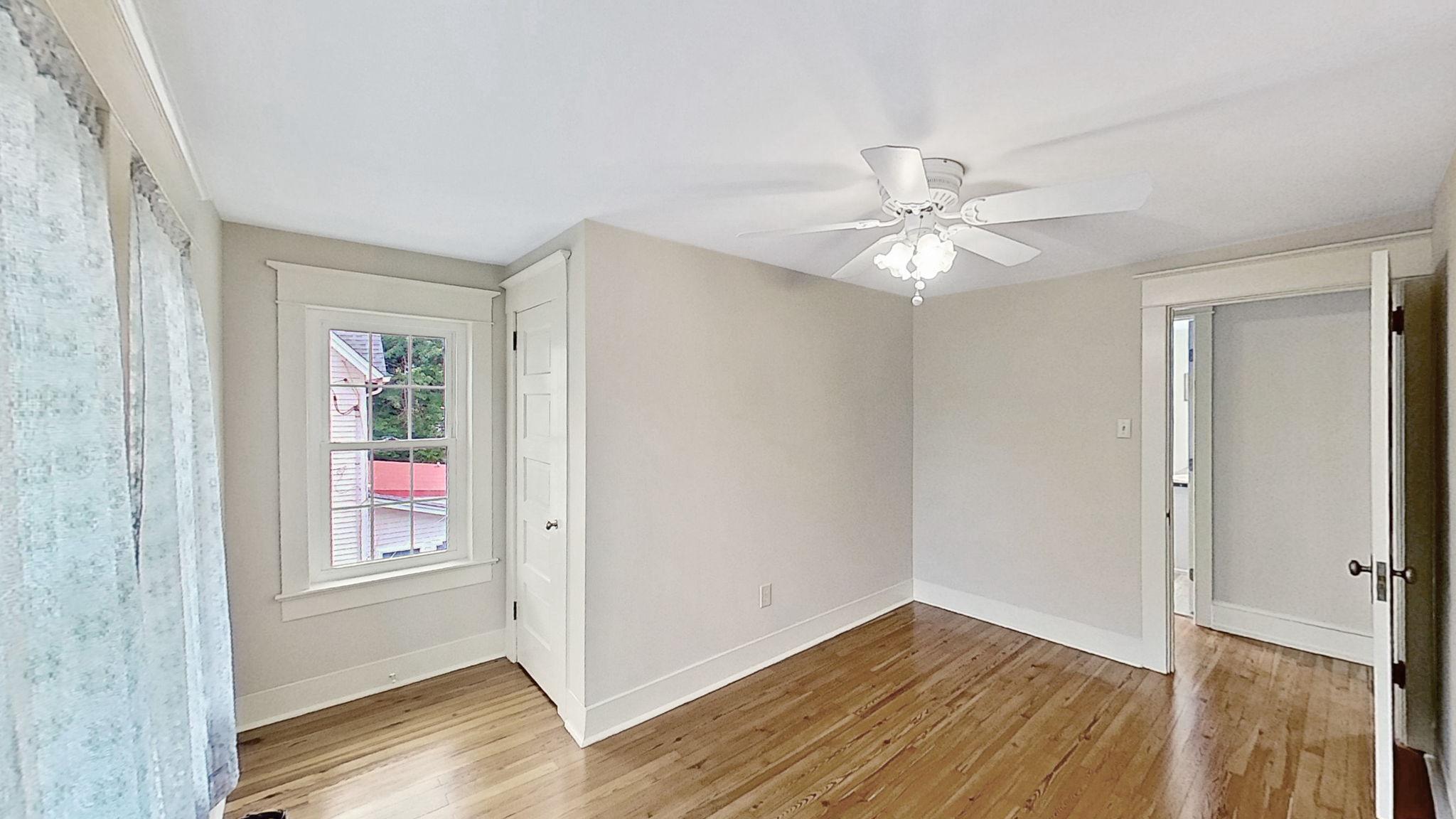 405 Union Street Milton, DE 19968 - Photo 48 of 83 wooden floor in an empty room with a window