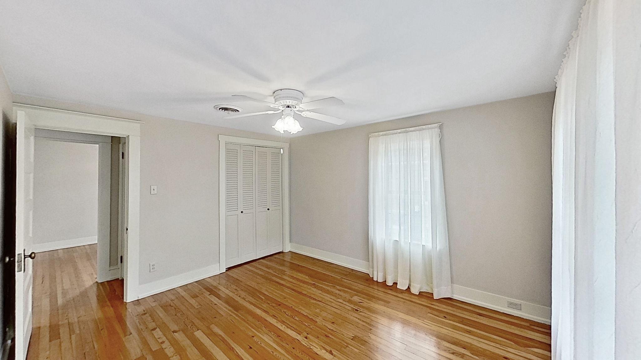 405 Union Street Milton, DE 19968 - Photo 50 of 83 a view of a room with wooden floor and white walls