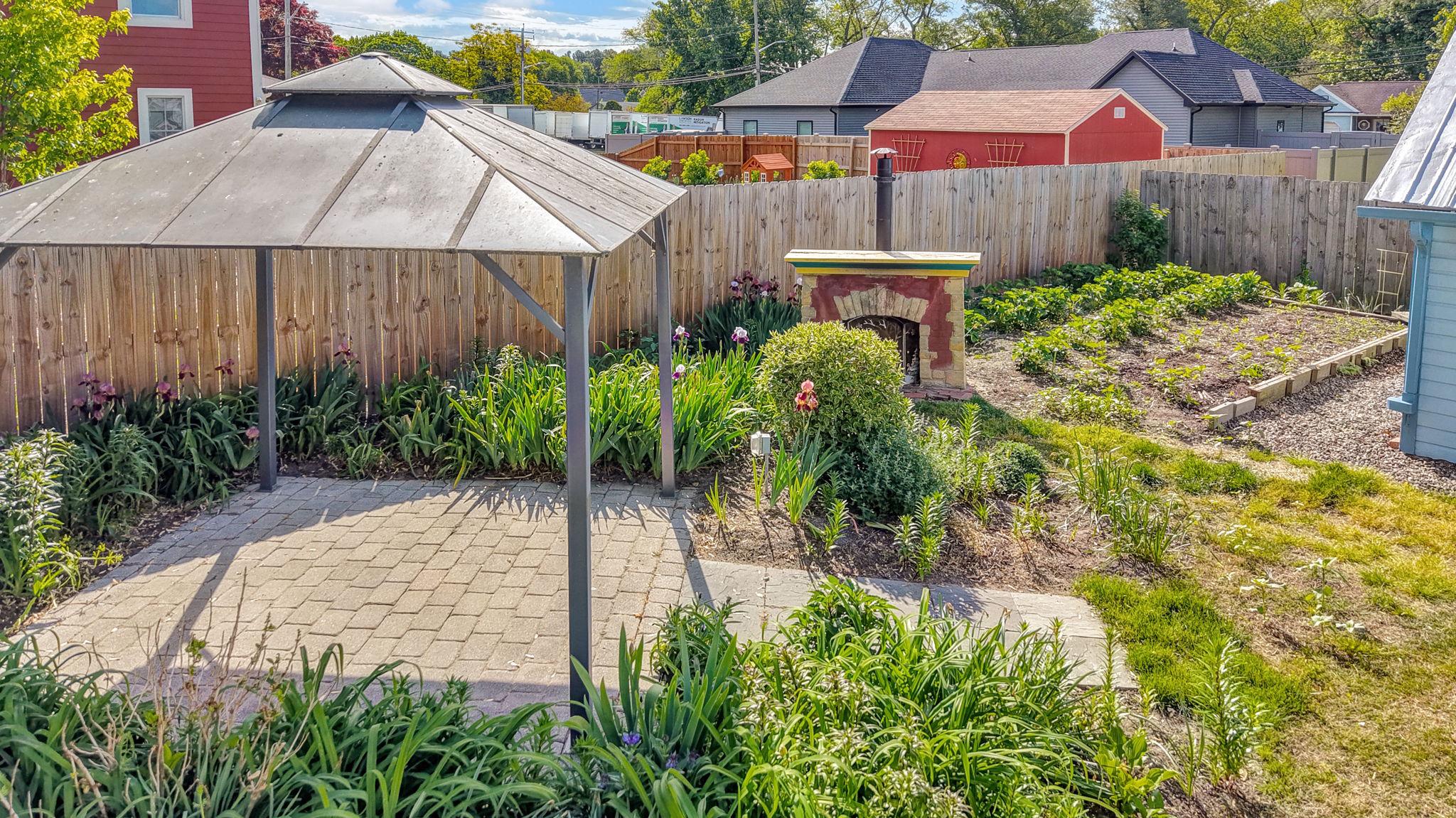 405 Union Street Milton, DE 19968 - Photo 64 of 83 a view of a backyard with plants and a barbeque