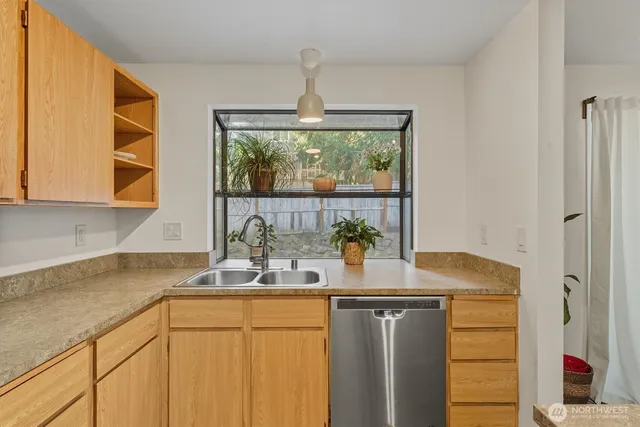 a kitchen with a sink and a window