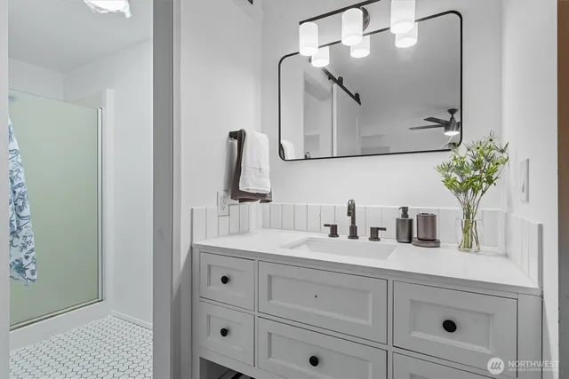 a bathroom with a sink and a mirror