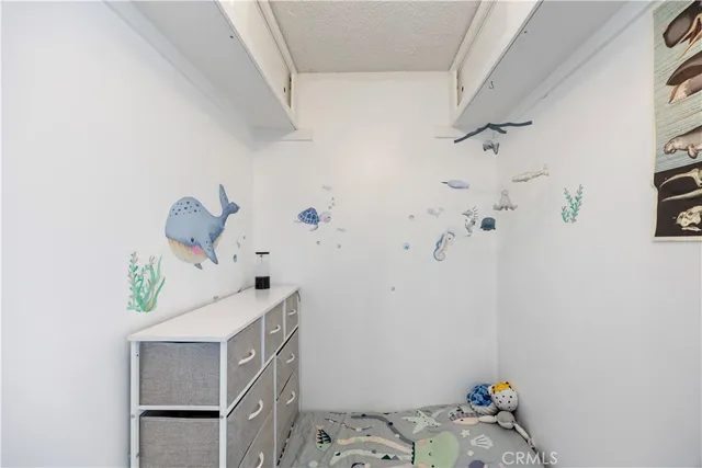 a view of a living room and a balcony