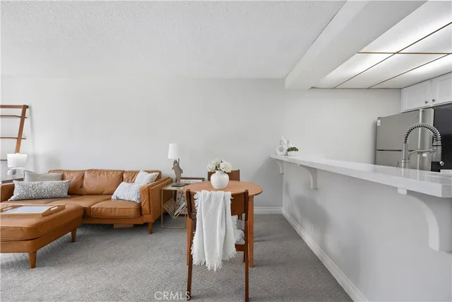 a living room with furniture a washer and dryer