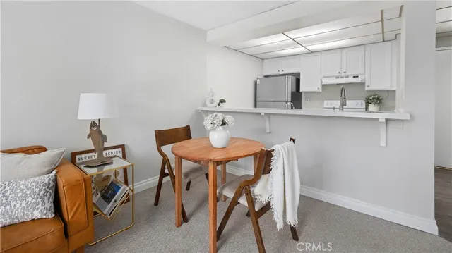 a bathroom with a shower curtain and a sink