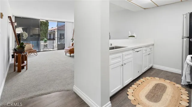 a room with a table and a chandelier