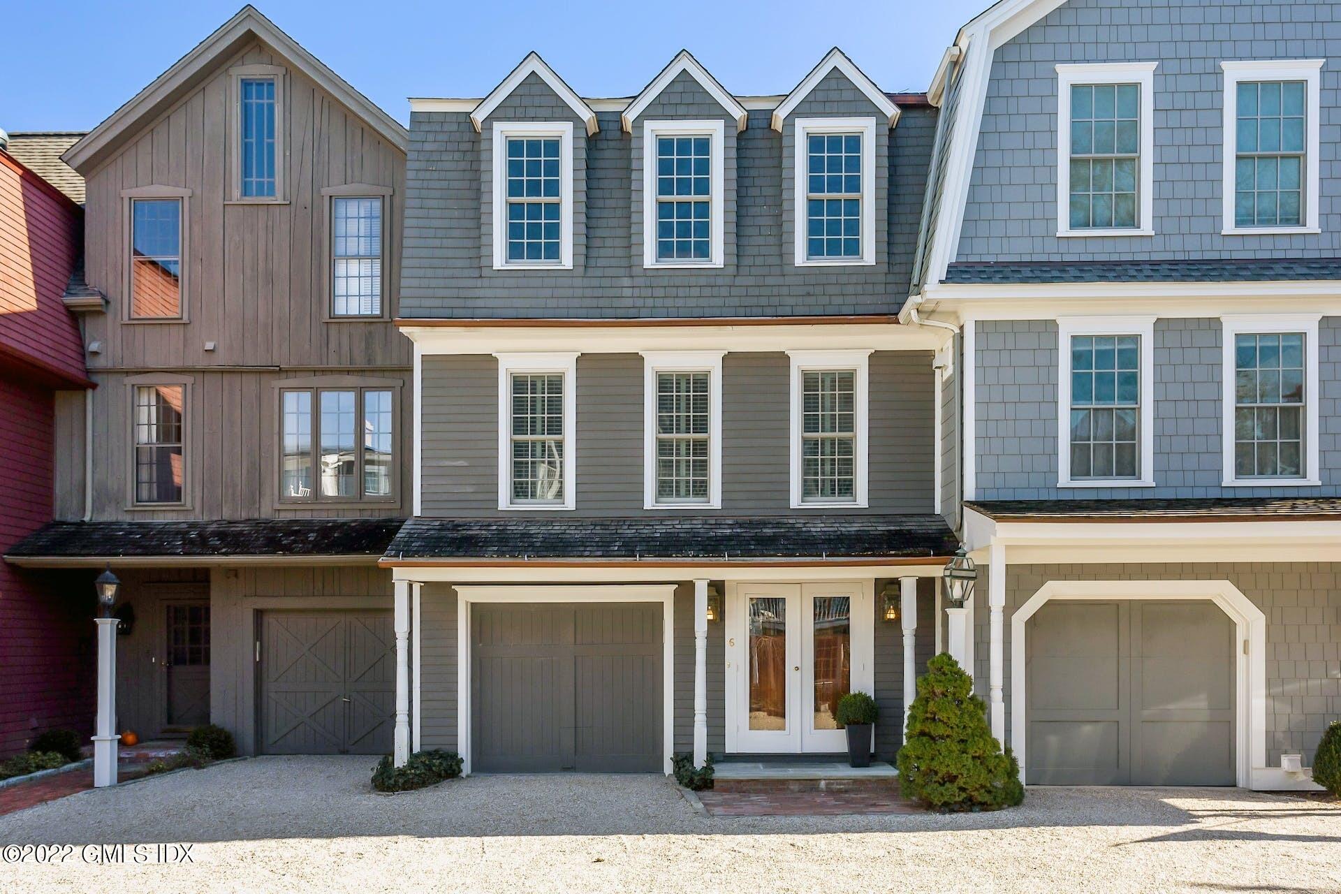 603 Steamboat Road, Unit 6 Greenwich, CT 06830 - Photo 2 of 40 a front view of a house with a yard