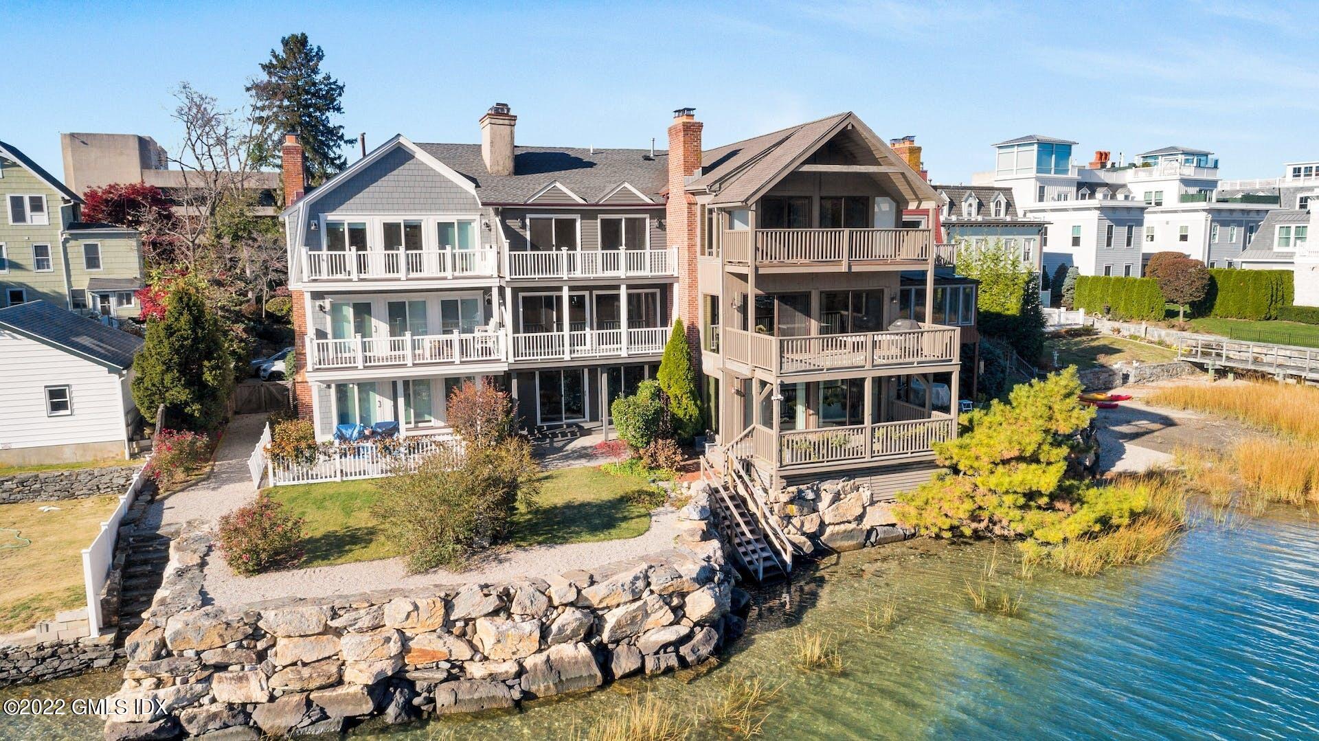 603 Steamboat Road, Unit 6 Greenwich, CT 06830 - Photo 35 of 40 a front view of a house with a yard