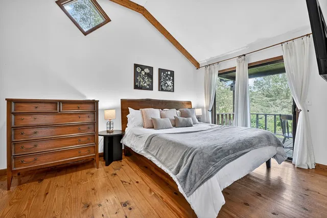 a bathroom with a sink a toilet a shower and a mirror