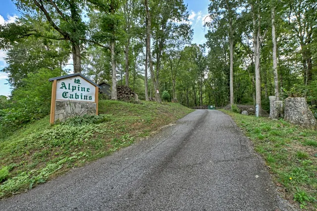 a view of a dining room with furniture and a kitchen