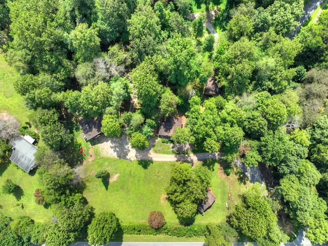 a living room with furniture a fireplace and a table