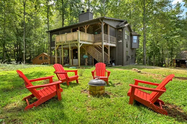 a spacious bathroom with a double vanity sink a toilet and a mirror