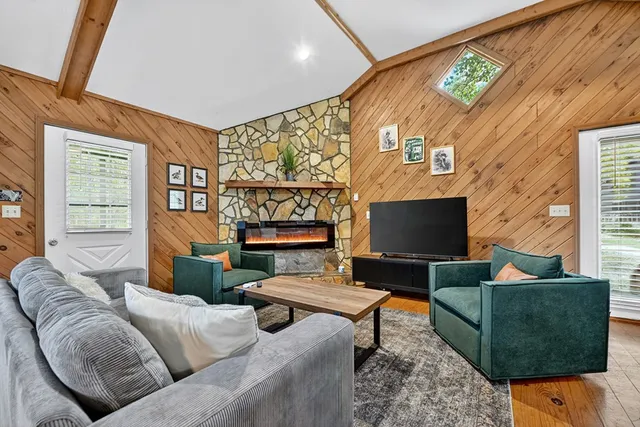 a view of balcony with wooden floor and outdoor seating