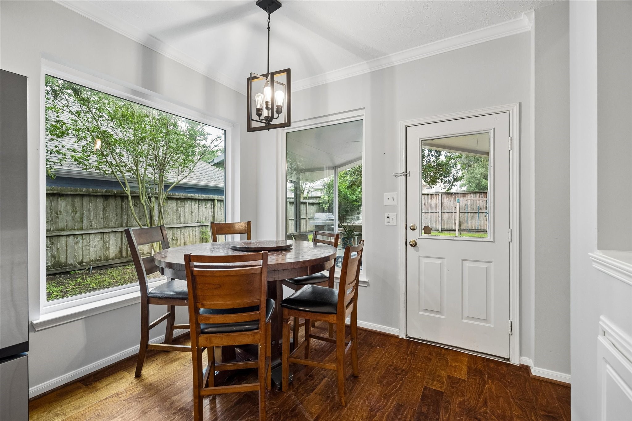 8123 Clarion Way Houston, TX 77040 - Photo 8 of 33 a view of a dining room with furniture window and wooden floor